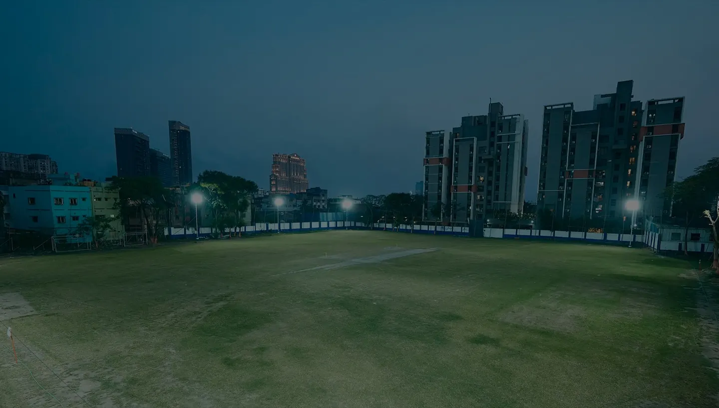 Harvard House Sports ground under floodlights at night