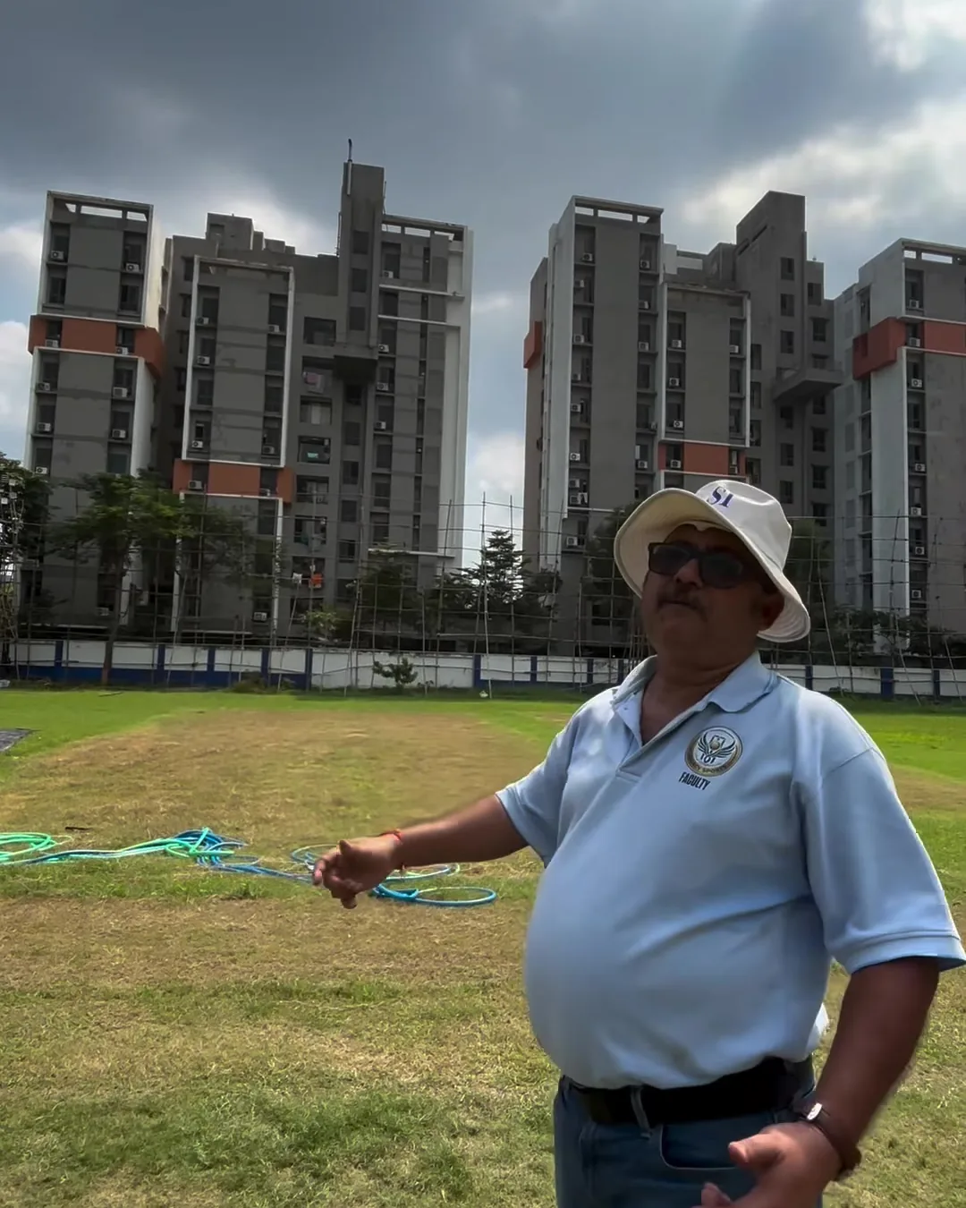 HHS coach on the ground with the Tangra skyline behind