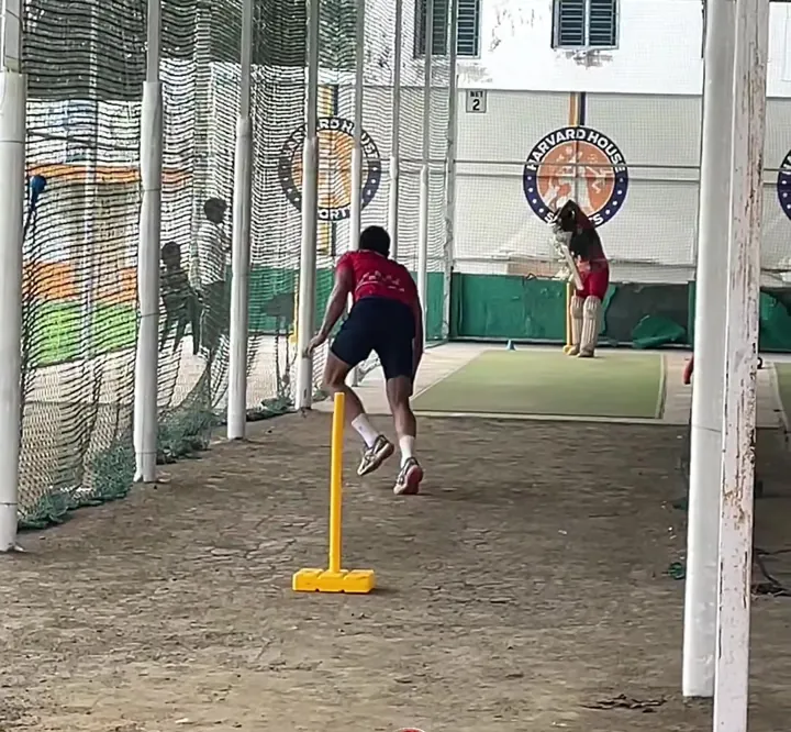 Fast bowler charging in during a nets session