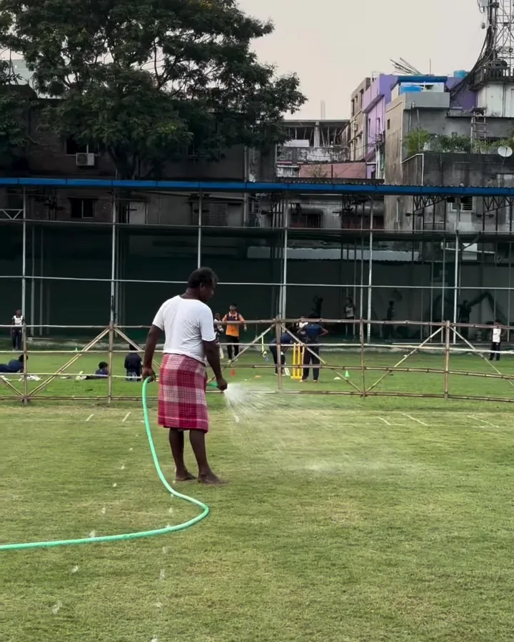Watering the outfield before play