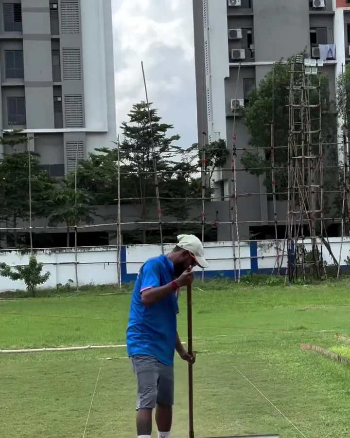 Batter on the ground with the Tangra high-rises behind