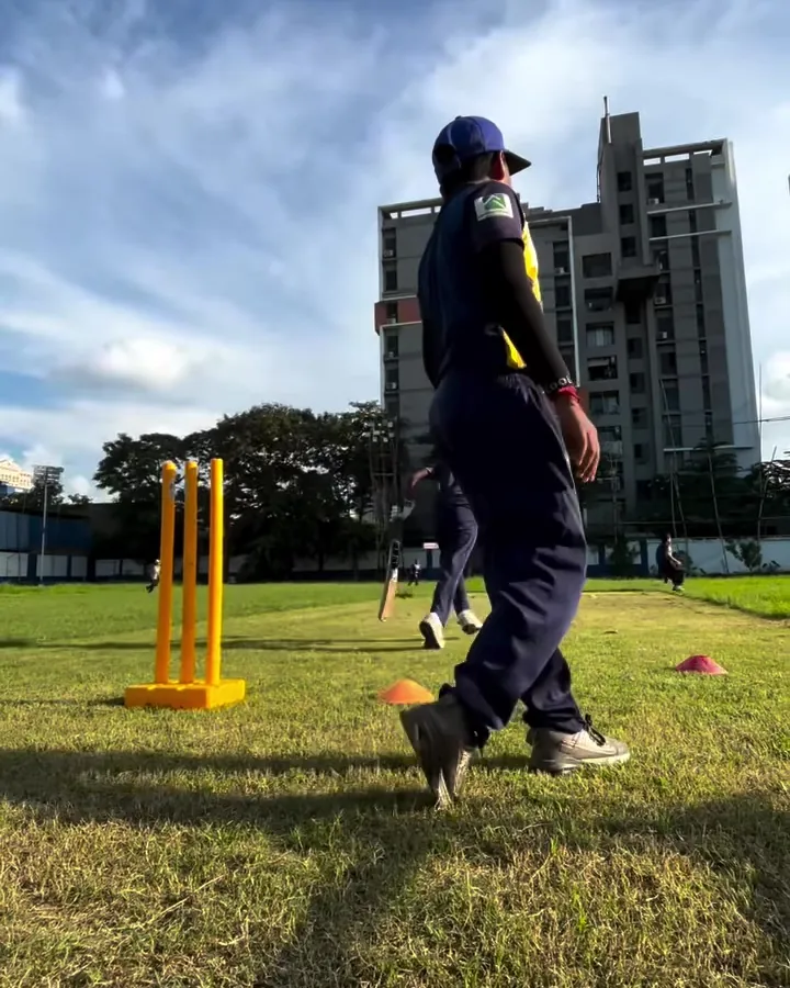 Junior fielding drill with cones and stumps